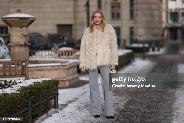 Marlies Pia Pfeifhofer seen wearing Ray-Ban Wayfarer black sunglasses, silver earrings, Dondup cream white fluffy fake fur jacket, Massimo Dutti...