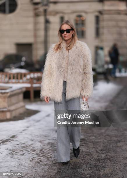 Marlies Pia Pfeifhofer seen wearing Ray-Ban Wayfarer black sunglasses, silver earrings, Dondup cream white fluffy fake fur jacket, Massimo Dutti...