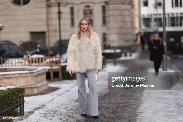 Marlies Pia Pfeifhofer seen wearing Ray-Ban Wayfarer black sunglasses, silver earrings, Dondup cream white fluffy fake fur jacket, Massimo Dutti...