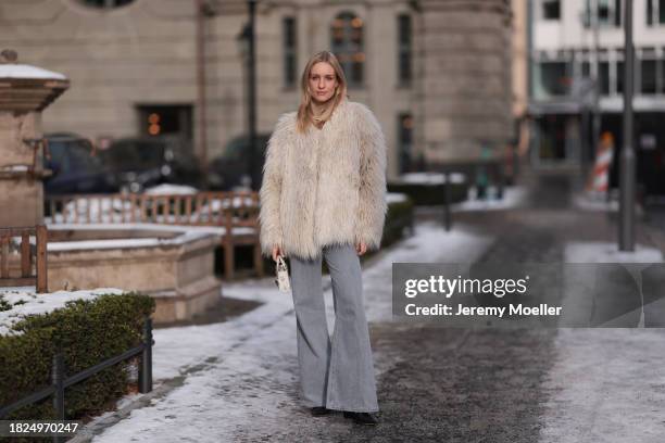 Marlies Pia Pfeifhofer seen wearing silver earrings, Dondup cream white fluffy fake fur jacket, Massimo Dutti light frey flared jeans / pants, Dior...