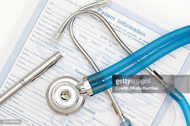 patient information sheet with a stethoscope - medische artikelen stockfoto's en -beelden