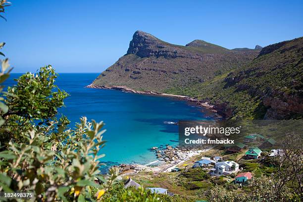 view of houses by the cape point coastline  - cape point stock pictures, royalty-free photos & images