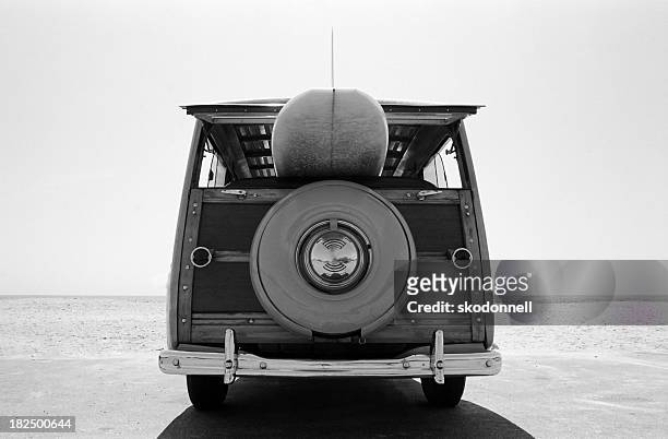 old  woodie station wagon with surfboard - surfboard stock pictures, royalty-free photos & images