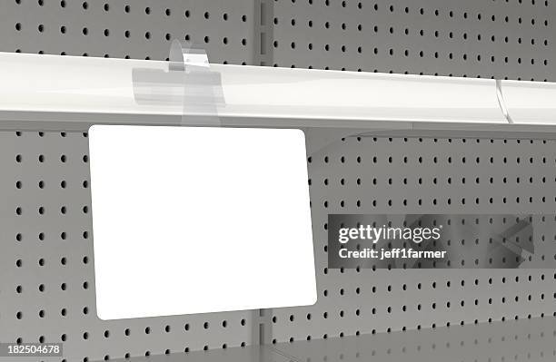 blank wobbler attached to a retail store shelf - market retail space stockfoto's en -beelden