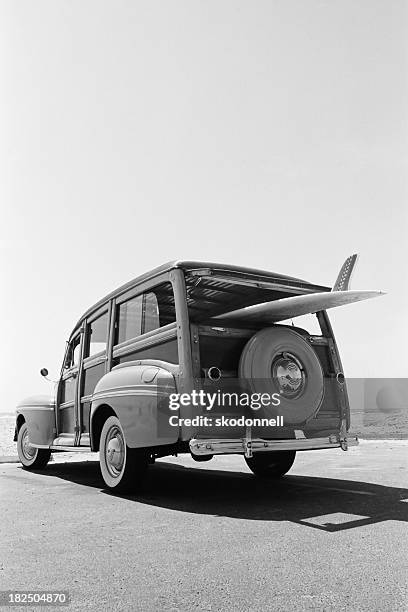 old woodie station wagon with surfboard - station wagon stock pictures, royalty-free photos & images