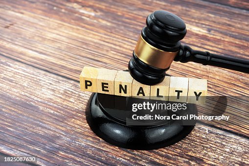 Penalty Text on Wood Block with Gavel and Block Penalty Text on Wood Block with Gavel and Block