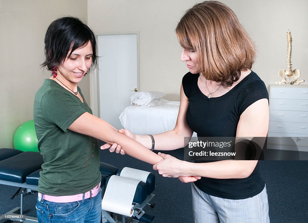 Chiropractor working on a patient's arm