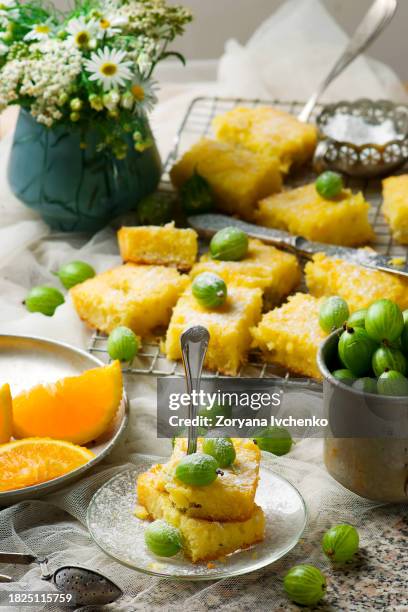 gooseberry and  orange drizzle cake - syrup drizzle stock pictures, royalty-free photos & images