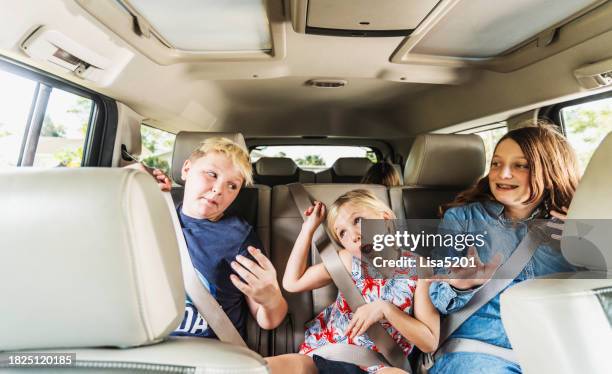 silly fun happy group of kids in the backseat of a car singing and dancing with joy - back seat stock pictures, royalty-free photos & images