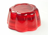 Red jelly with cherry flavor on white background