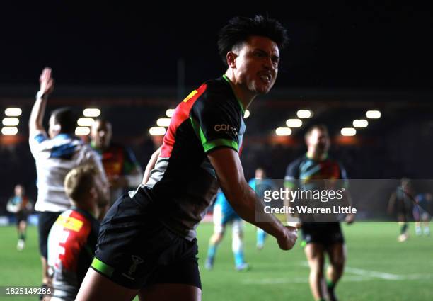 Marcus Smith of Harlequins celebrates the opening try of team mate Tyrone Green of Harlequins during the Gallagher Premiership Rugby match between...