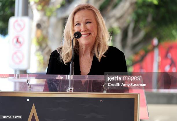 Catherine O'Hara speaks onstage during the ceremony honoring Macaulay Culkin with a Star on the Hollywood Walk of Fame on December 01, 2023 in...
