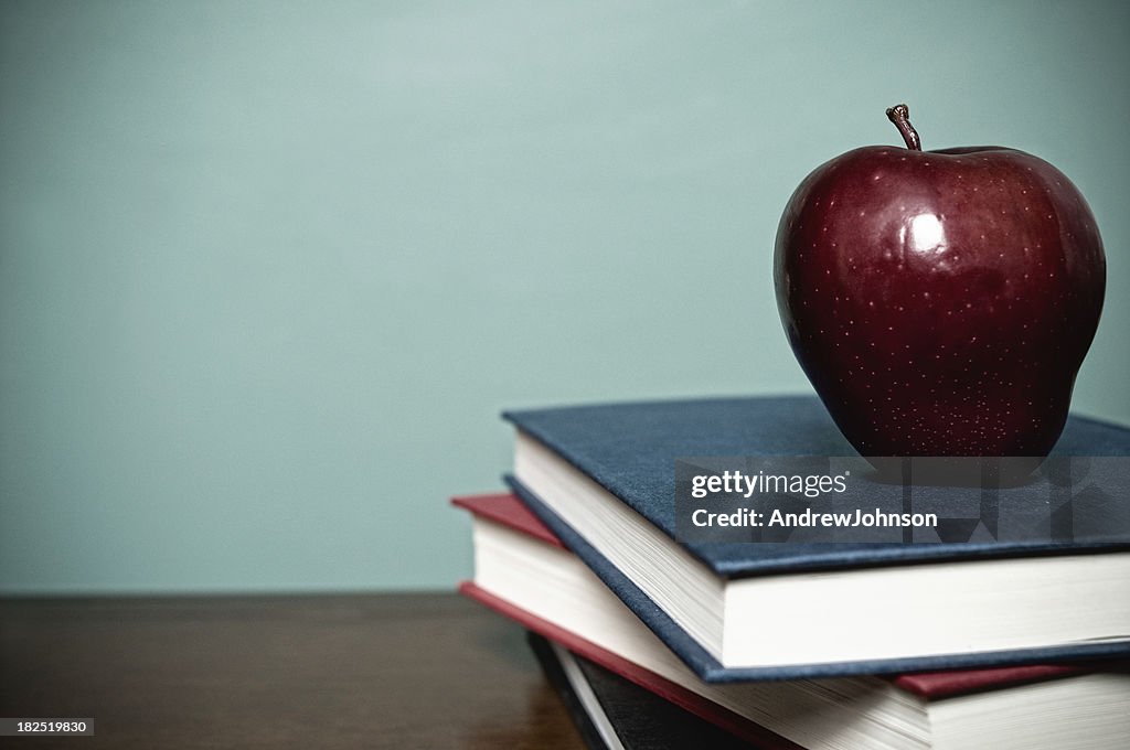 School Books and Red Apple