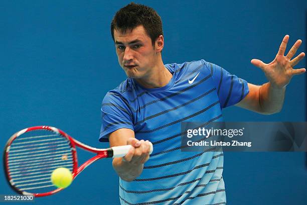 Bernard Tomic of Australia returns a ball to Zhang Ze of China on day three of the 2013 China Open at National Tennis Center on September 30, 2013 in...