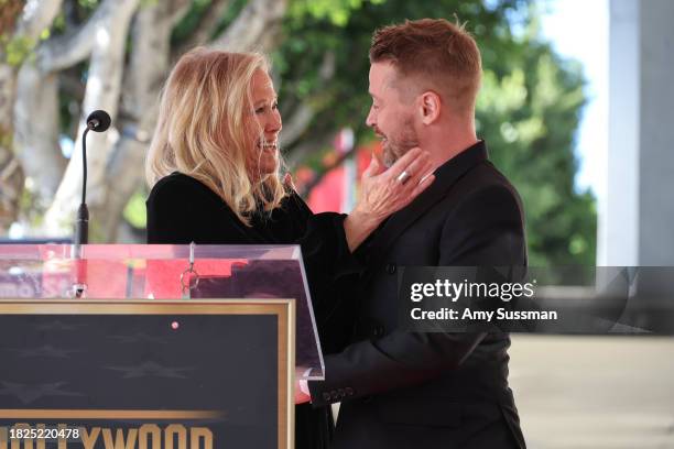 Catherine O'Hara and Macaulay Culkin speak onstage during the ceremony honoring Macaulay Culkin with a Star on the Hollywood Walk of Fame on December...