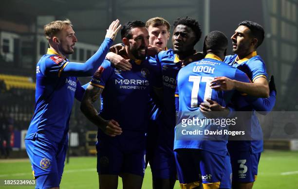 Ryan Bowman of Shrewsbury Town celebrates with team mates after scoring their first goal during the Emirates FA Cup Second Round match between Notts...