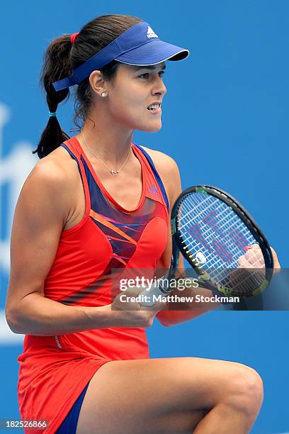 Ana Ivanovic of Serbia celebrates a point against Flavia Pennetta of Italy during day three of the 2013 China Open at the National Tennis Center on...