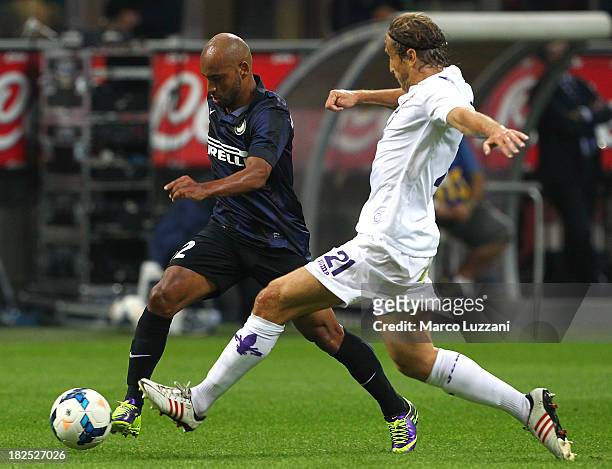 Cicero Moreira Jonathan of FC Internazionale Milano competes for the ball with Massimo Ambrosini of ACF Fiorentina during the Serie A match between...