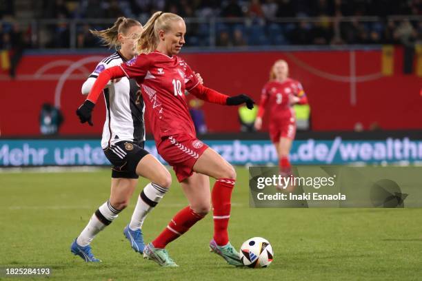 Amalie Vangsgaard from Denmark in action covered by Sarai Linder from Germany during the UEFA Womens Nations League match between Germany and Denmark...