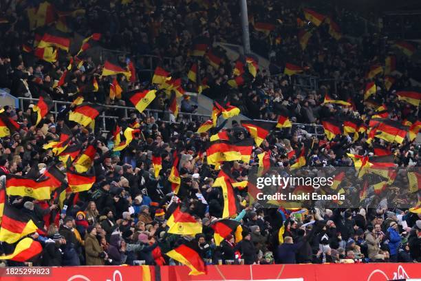 Germany supporters celebrate their team's goal during the UEFA Womens Nations League match between Germany and Denmark at Ostseestadion on December...