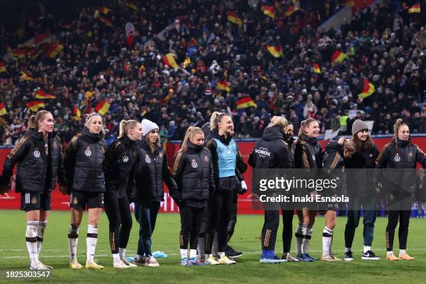 Germany's national squad celebrate their victory with their supporters during the UEFA Womens Nations League match between Germany and Denmark at...