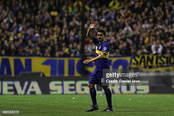 Juan Roman Riquelme, of Boca Juniors, waves to supporters during a match between Boca Juniors and Quilmes as part of the Torneo Inicial 2013 at...