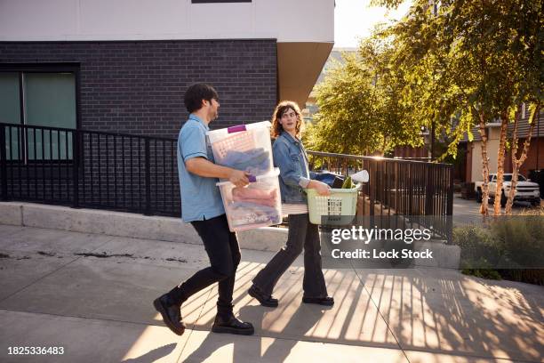 father helping son move into college dorm - student accommodation stock pictures, royalty-free photos & images