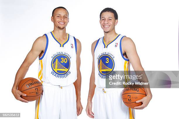 Stephen Curry and Seth Curry pose for a photo on Golden State Warriors media day held September 27, 2013 at the Warriors practice facility in...