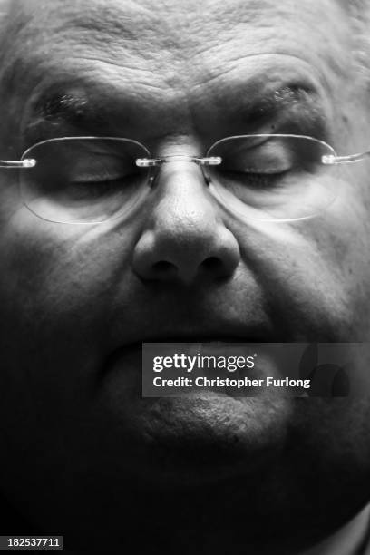 Secretary of State for Communities and Local Government Eric Pickles waits in the lobby of the Midland Hotel on the second day of the Conservative...