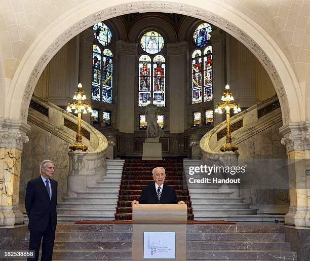 In this handout photo provided by the Israeli Government Press Office , Israeli President Shimon Peres speaks at the International Court of Justice...