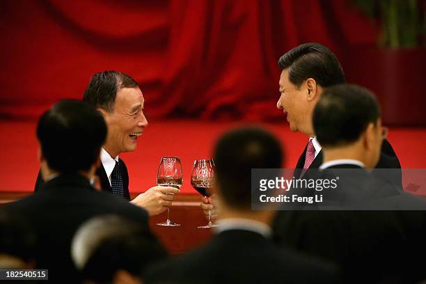 Chinese President Xi Jinping and Secretary of the Central Commission for Discipline Inspection Wang Qishan toast with high-ranking Chinese officials...