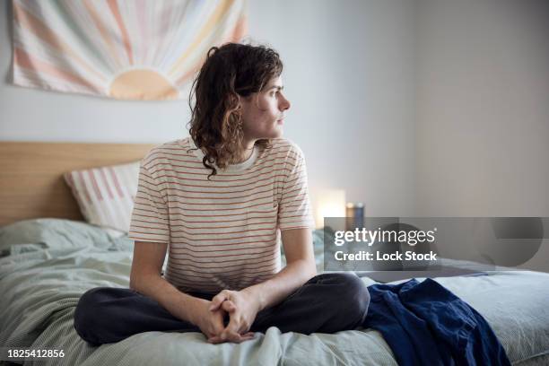 college student on bed - independence community college stock pictures, royalty-free photos & images