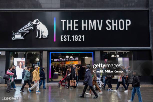 New signage outside the recently reopened flagship HMV store on Oxford Street as the famous His Masters Voice sign is hidden again following a period...