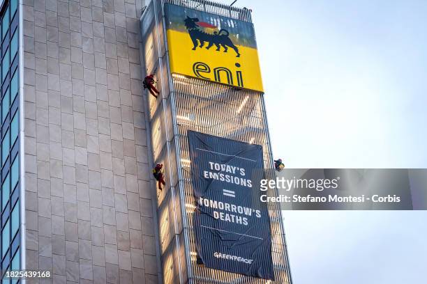 Greenpeace activists climb both sides of the ENI headquarters building and unfurled two huge banners with the inscription 'Today's emissions =...