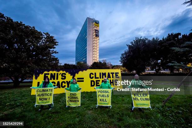 Greenpeace activists placed an 8-metre long installation near the ENI headquarters building with the message 'ENI's legacy = climate deaths' on...