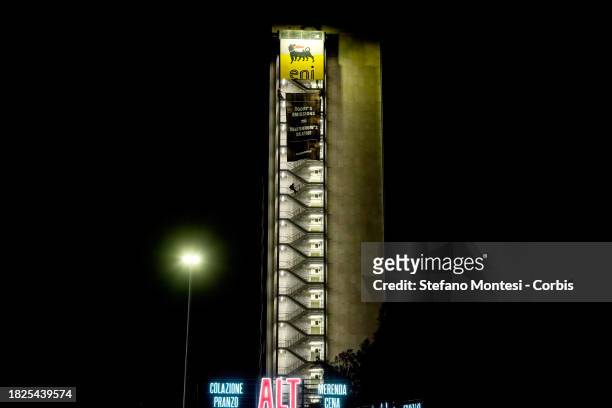 Greenpeace activists climb both sides of the ENI headquarters building and unfurled two huge banners with the inscription 'Today's emissions =...