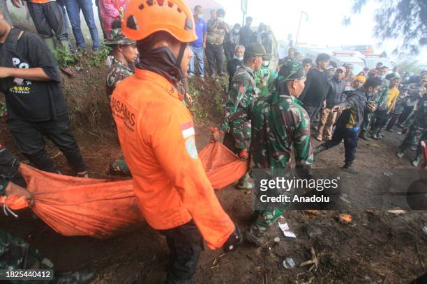 Joint SAR team evacuates a body after the eruption of Mount Marapi in Agam District, West Sumatera, Indonesia on December 05, 2023. At least 22...