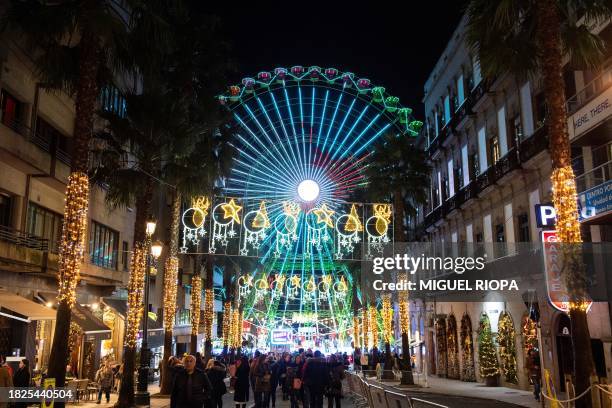 This photograph shows a street decorated with Christmas lights in Vigo, northwestern Spain, on December 4, 2023.