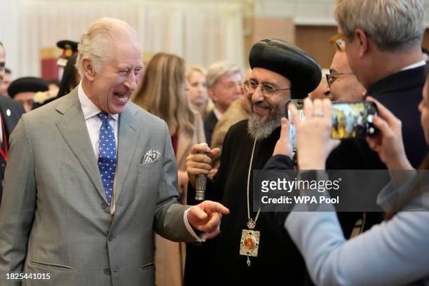 King Charles III and Archbishop Angaelos, right, arrive to attend an Advent Service and Christmas Reception at The Coptic Orthodox Church Centre UK...