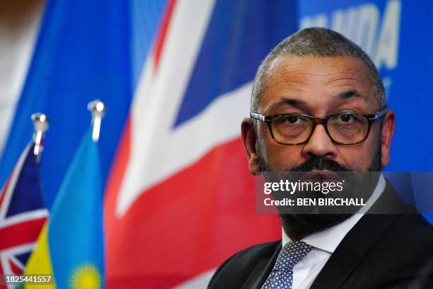 Britain's Home Secretary James Cleverly speaks during a joint press conference with his Rwanda's Foreign Minister after signing a new treaty, in...