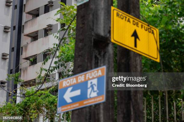 Escape route signs near an evacuated apartment building located in an area at risk of ground sinking in Maceio, Alagoas state, Brazil, on Monday,...