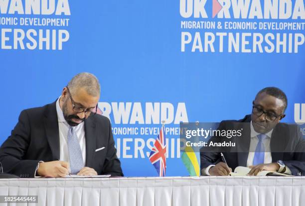 Home Secretary James Cleverly and Rwandan Foreign Minister Vincent Biruta sign a new deal on a reworked asylum scheme in Kigali, Rwanda on December...