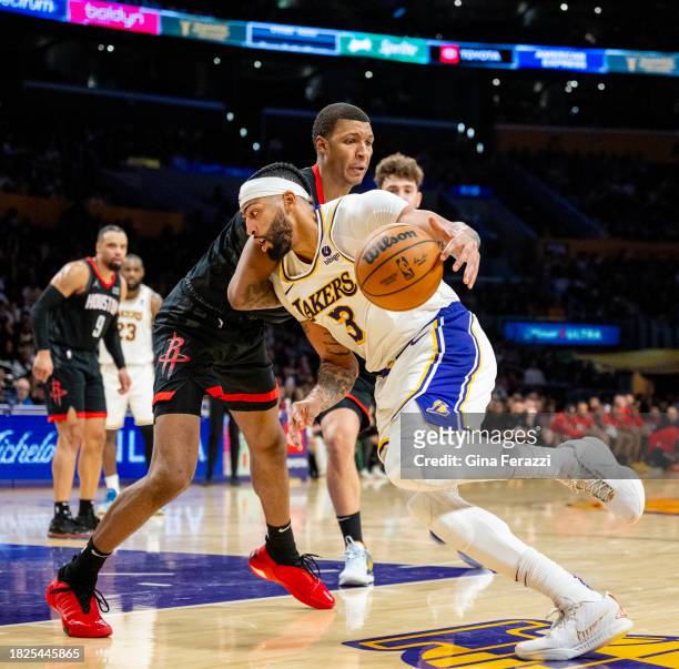 Los Angeles Lakers forward Anthony Davis drives to the basket against Houston Rockets forward Jabari Smith Jr. At Crypton.com Arena on December 2,...