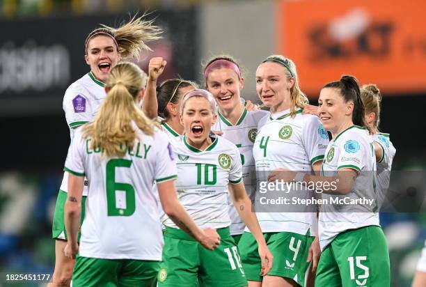 Belfast , United Kingdom - 5 December 2023; Louise Quinn of Republic of Ireland, third from right, celebrates with teammates, from left, Megan...
