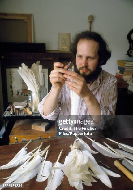 An artisan making quills from swan feathers, circa 1982.