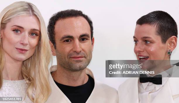 Australian actress Elizabeth Debicki, British actor Khalid Abdalla and British actor Emma Corrin pose on the red carpet upon arrival to attend the...