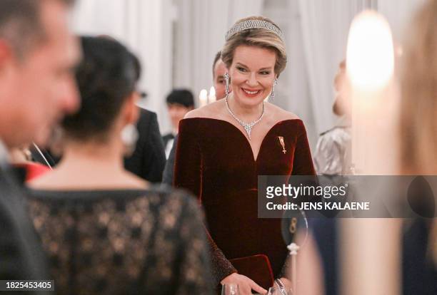Queen Mathilde of Belgium reacts at a state banquet at the presidential Bellevue Palace in Berlin, on December 5, 2023.