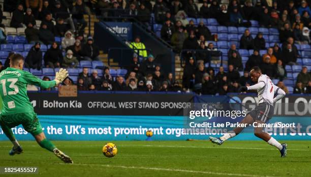 Bolton Wanderers' Carlos Mendes Gomes scores his side's second goal beating Port Vale's Jayson Leutwiler during the Bristol Street Motors Trophy...