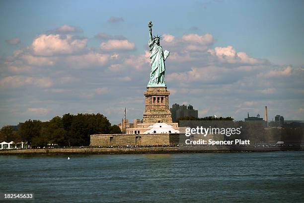 The Statue of Liberty, one of New York's premiere tourist attractions, is viewed from the Staten Island Ferry on September 30, 2013 in New York City....