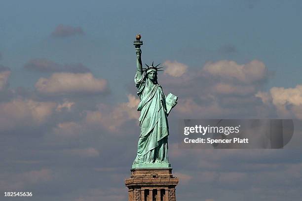 The Statue of Liberty, one of New York's premiere tourist attractions, is viewed from the Staten Island Ferry on September 30, 2013 in New York City....